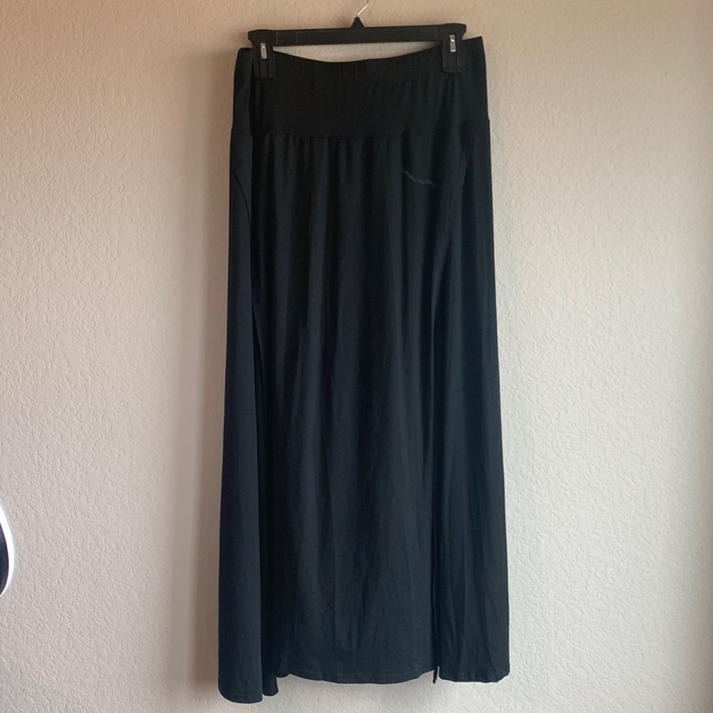 Women’s ankle length black skirt with front panel.